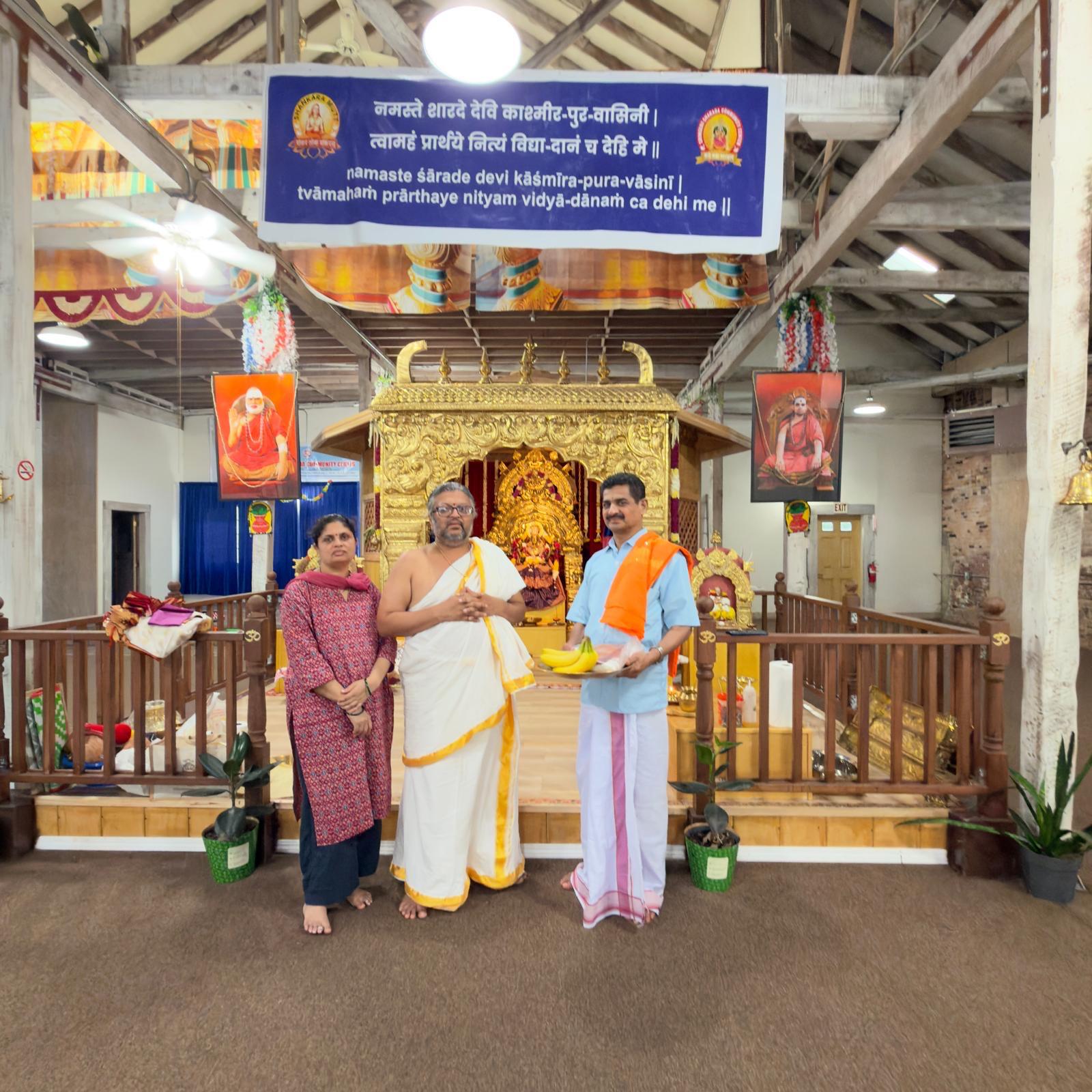 Devotees and priests gathered in front of the shrine
