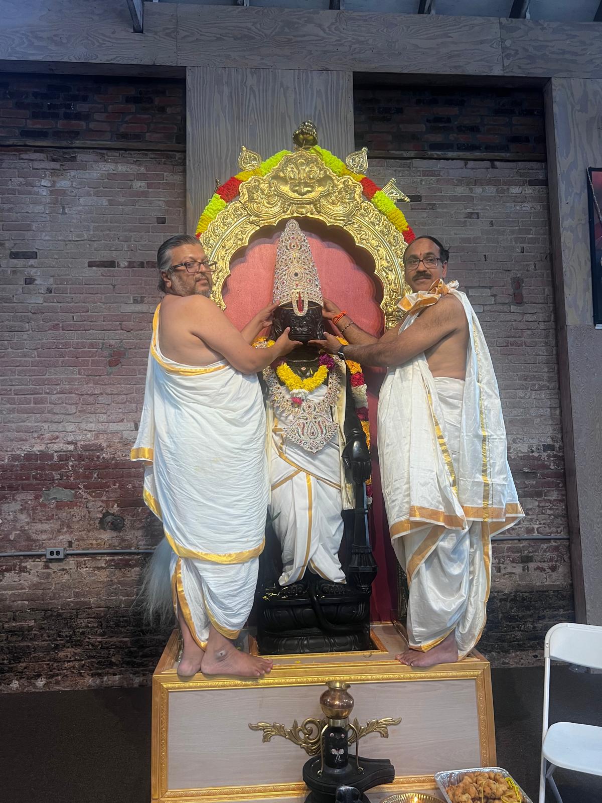 Priests standing before the shrine